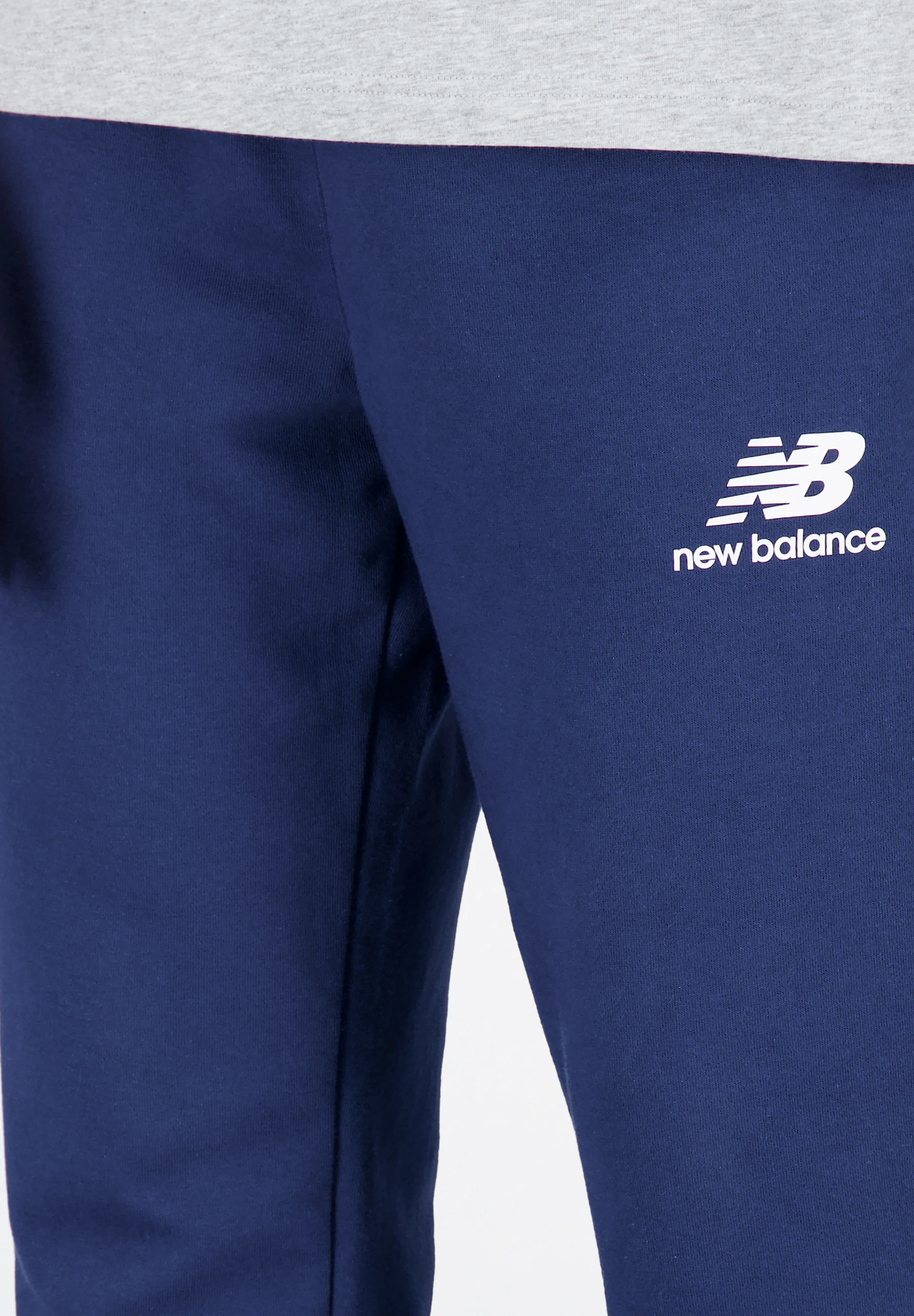 New Balance ESSENTIALS STACKED LOGO - Pantalones de chándal