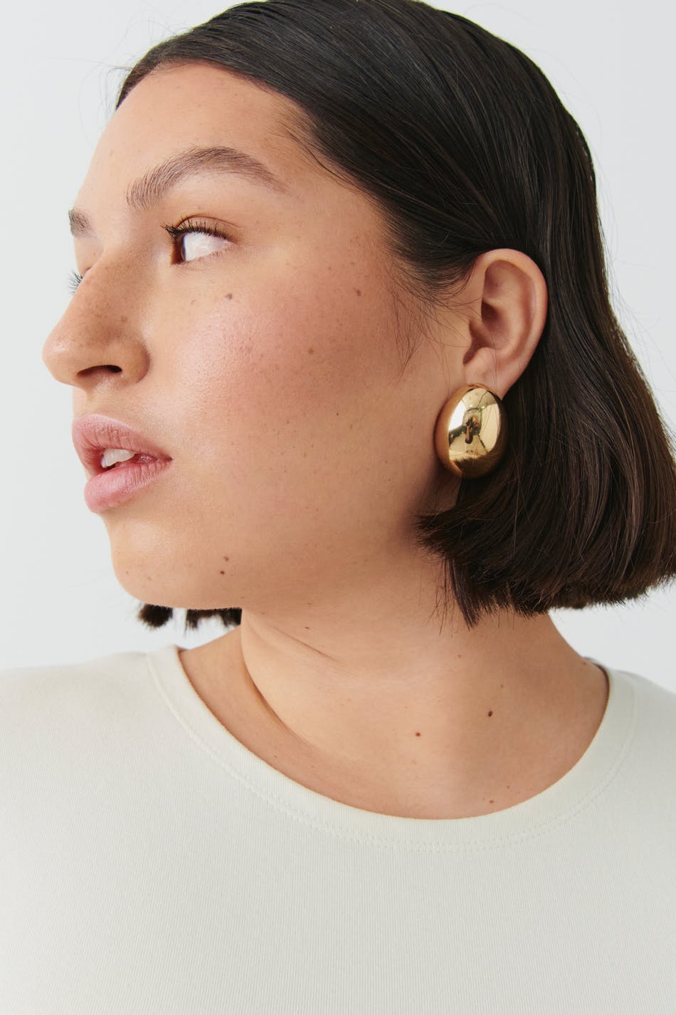 Uneven oversized earrings