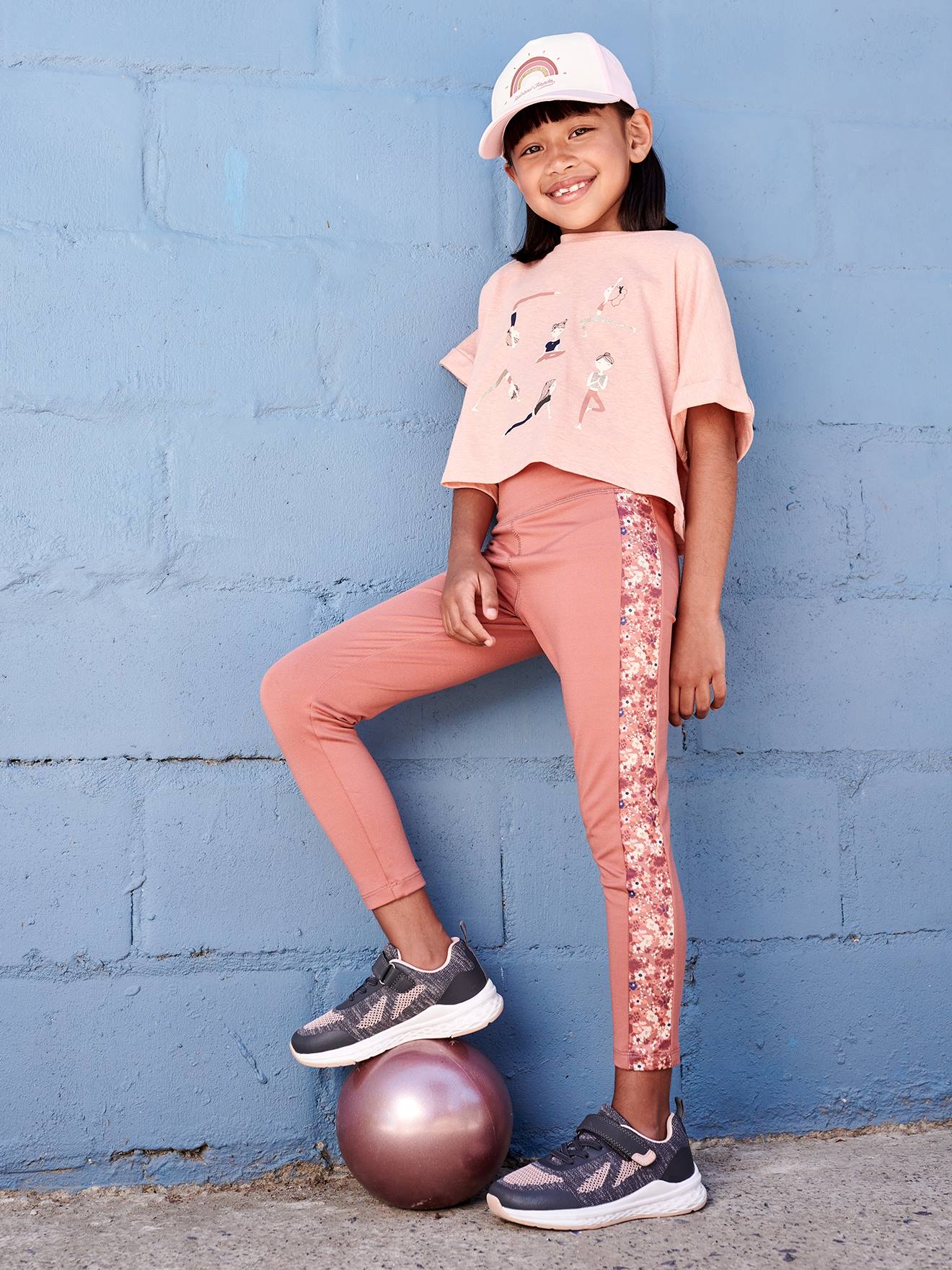 Legging sport matière technique fille bande côtés motifs fleurs terracotta