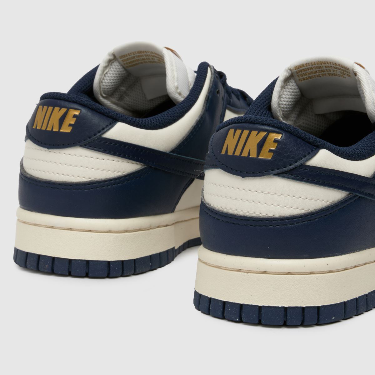 Nike Dunk Low-sneakers i elfenbensfärgad och marinblå