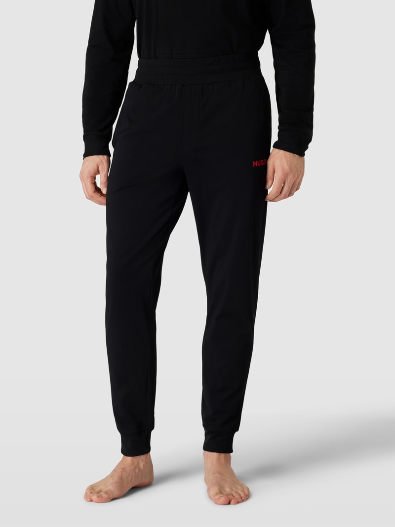 Sweatpants in unifarbenem Design mit elastischem Bund in schwarz
