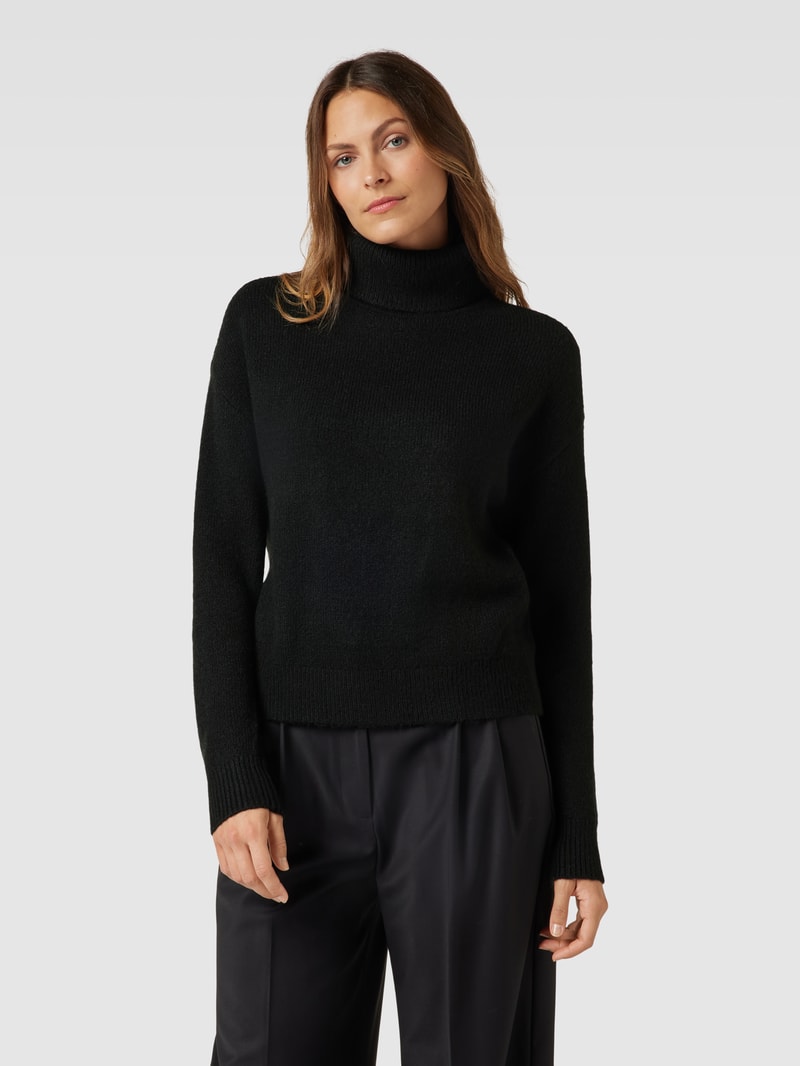 Rollkragenpullover mit überschnittenen Schultern in schwarz