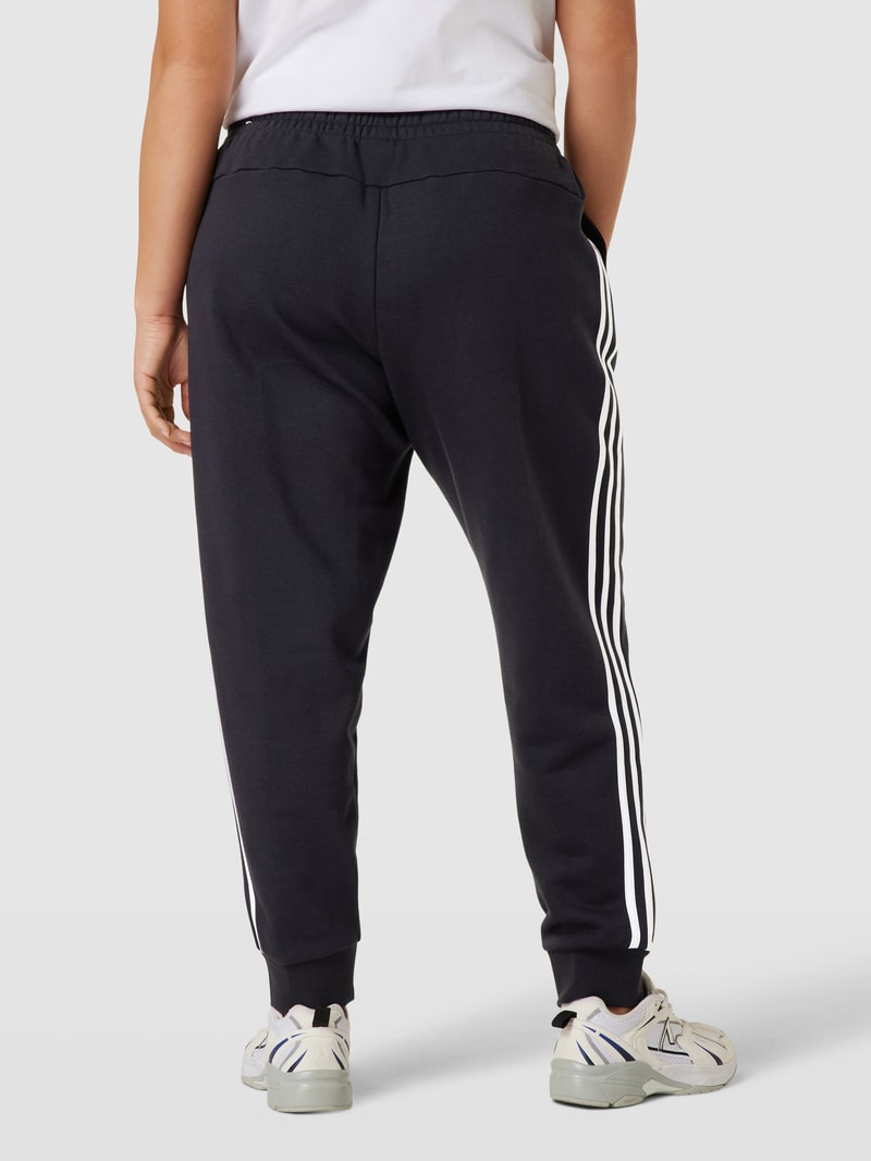 PLUS SIZE Sweatpants mit labeltypischen Galonstreifen in schwarz