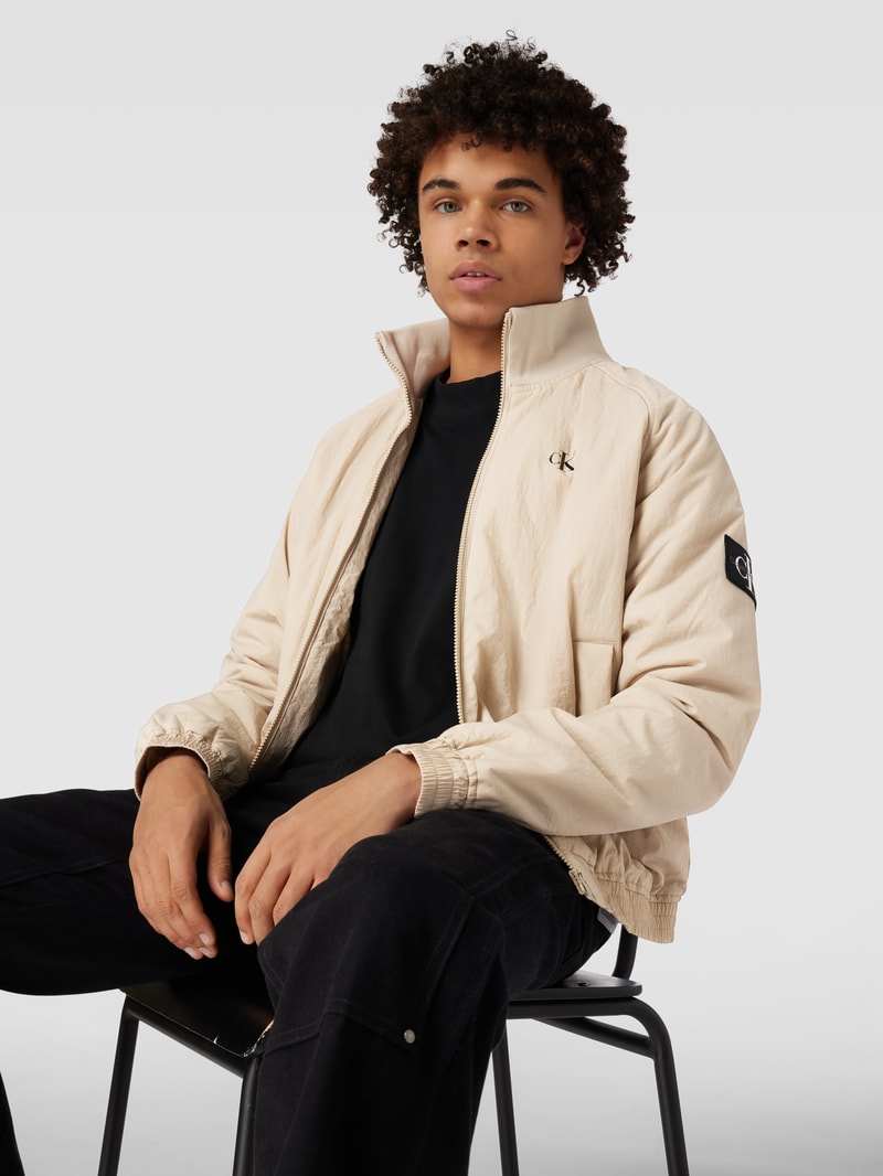 Blouson mit Logo-Print und Eingrifftaschen in beige