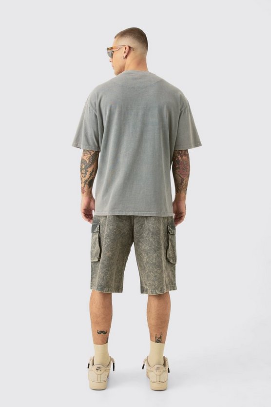 Zerrissenes Oversize T-Shirt mit Acid-Waschung und Man-Stickerei