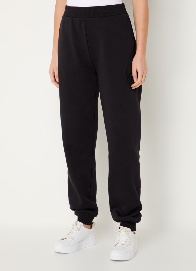 Pantaloni de trening Calvin Klein cu talie înaltă, cu croială conică pe picioare și buzunare laterale.