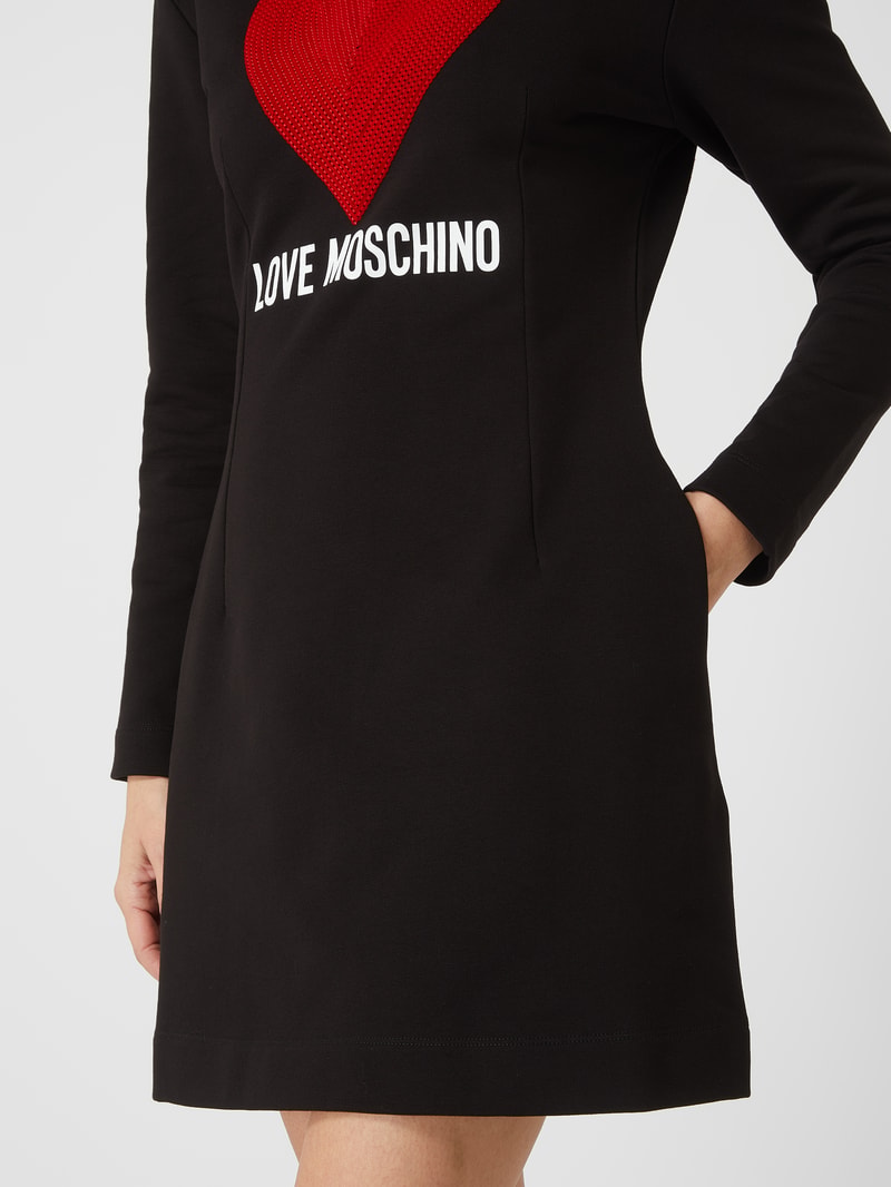 Sweatkleid mit Pailletten in schwarz