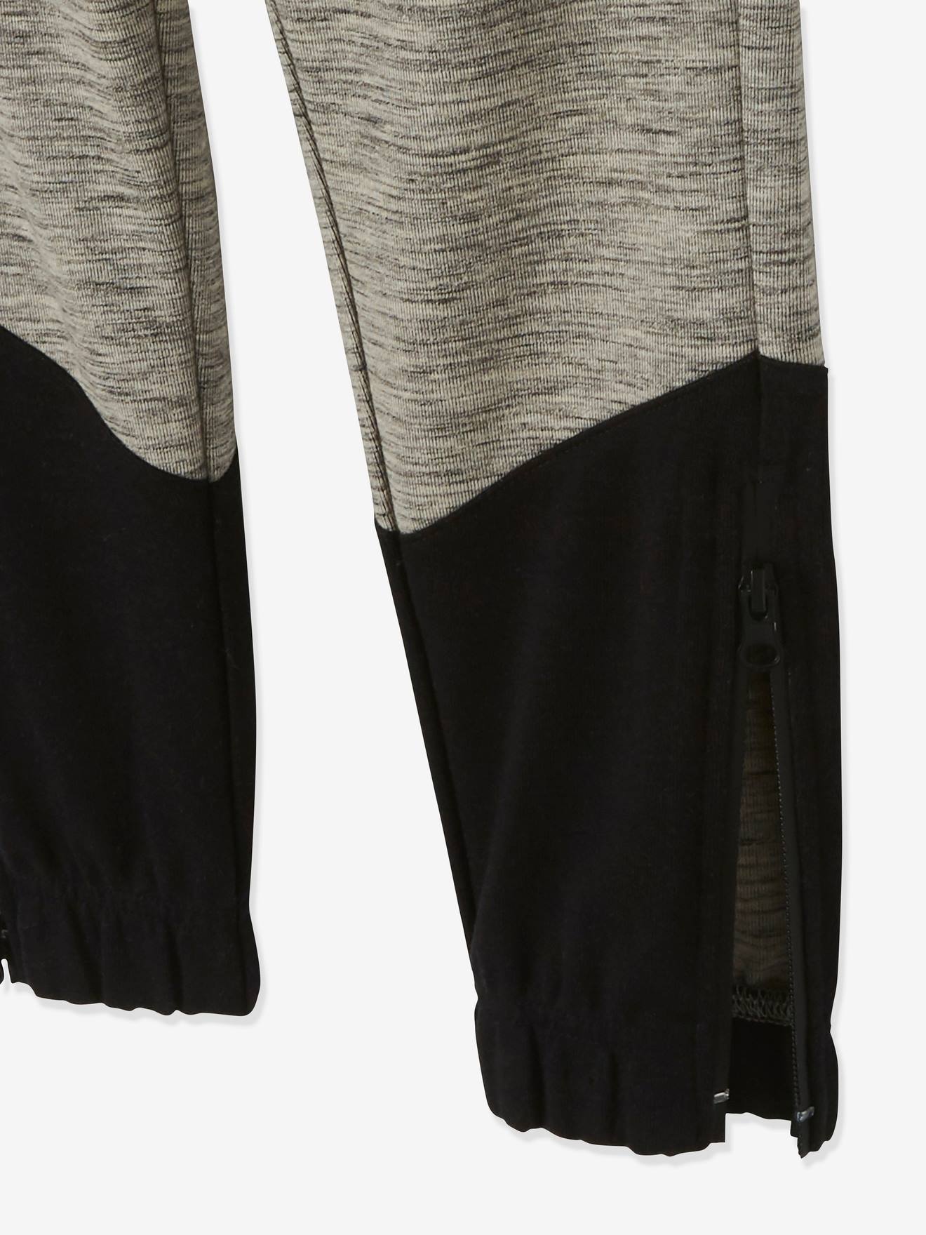 Pantalon de sport garçon en matière technique détails fluo noir