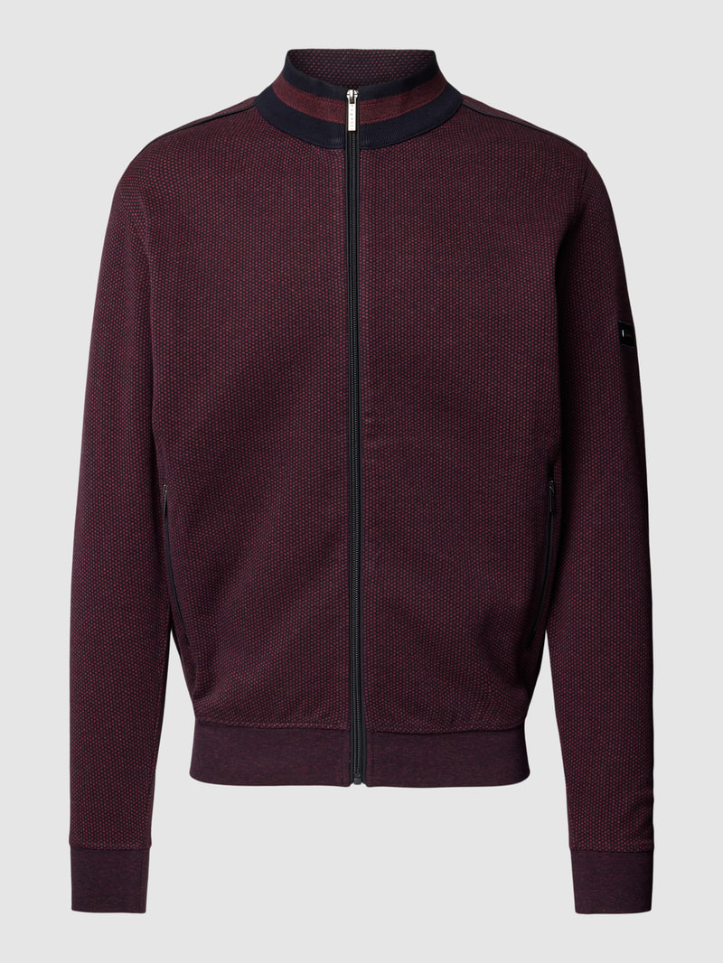 Sweatjacke mit Stehkragen und Reißverschlusstaschen in bordeaux rot