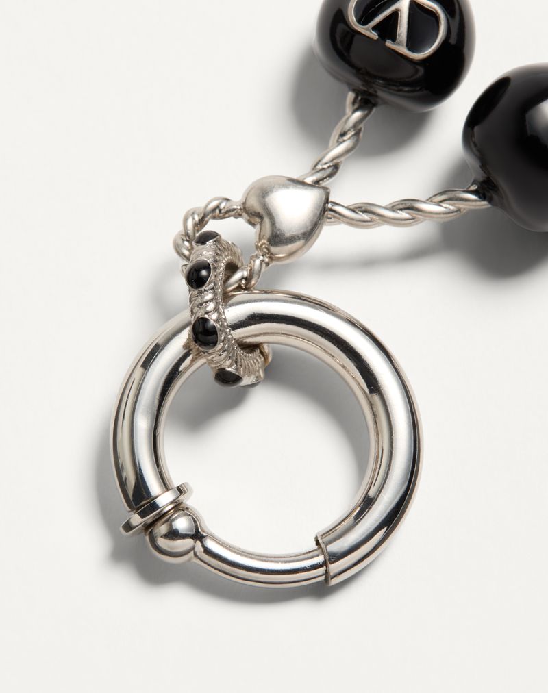 Brinco único Chez Valentino em metal e esmalte
