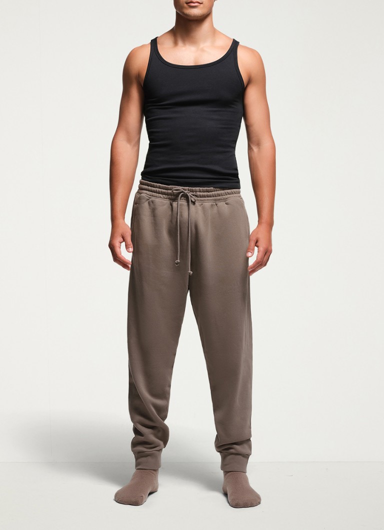 Pantaloni de trening din fleece SKIMS, cu croială slim și buzunare laterale.
