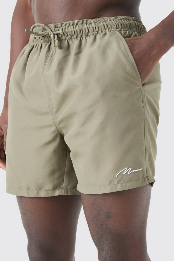 Man Signature mittellange Badehose