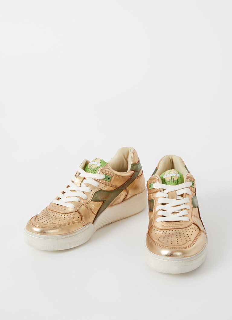 Diadora B560 lietotas ādas kedas ar metālisku apdari