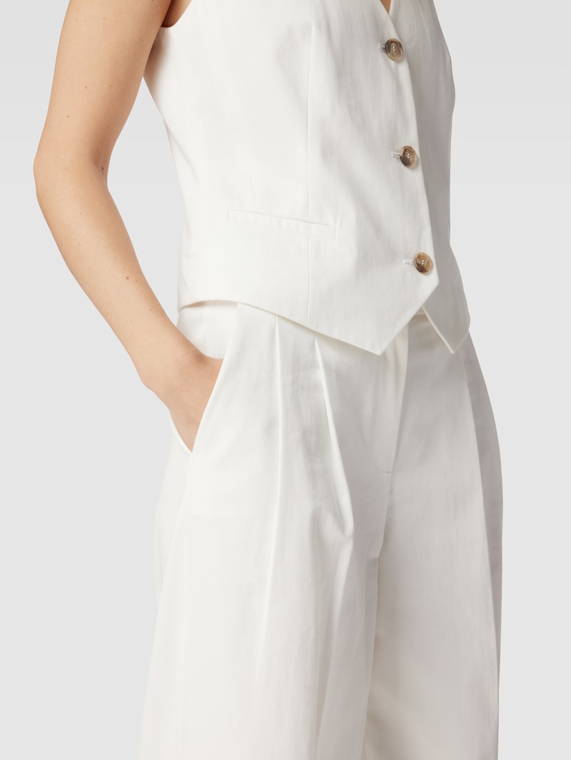 Loose Fit Bundfaltenhose mit französischen Eingrifftaschen in offwhite