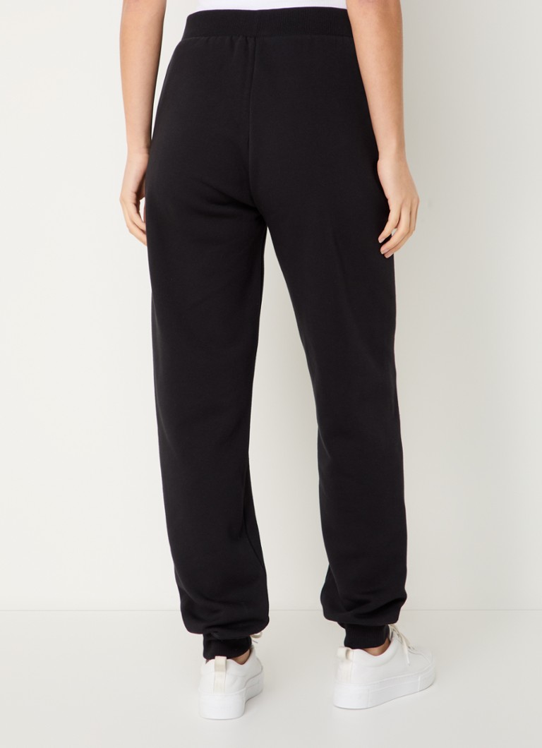Pantaloni de trening Calvin Klein cu talie înaltă, cu croială conică pe picioare și buzunare laterale.