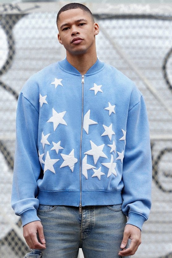 Kastige Oversize Jersey-Bomberjacke mit Acid-Waschung und Sternen-Applikation