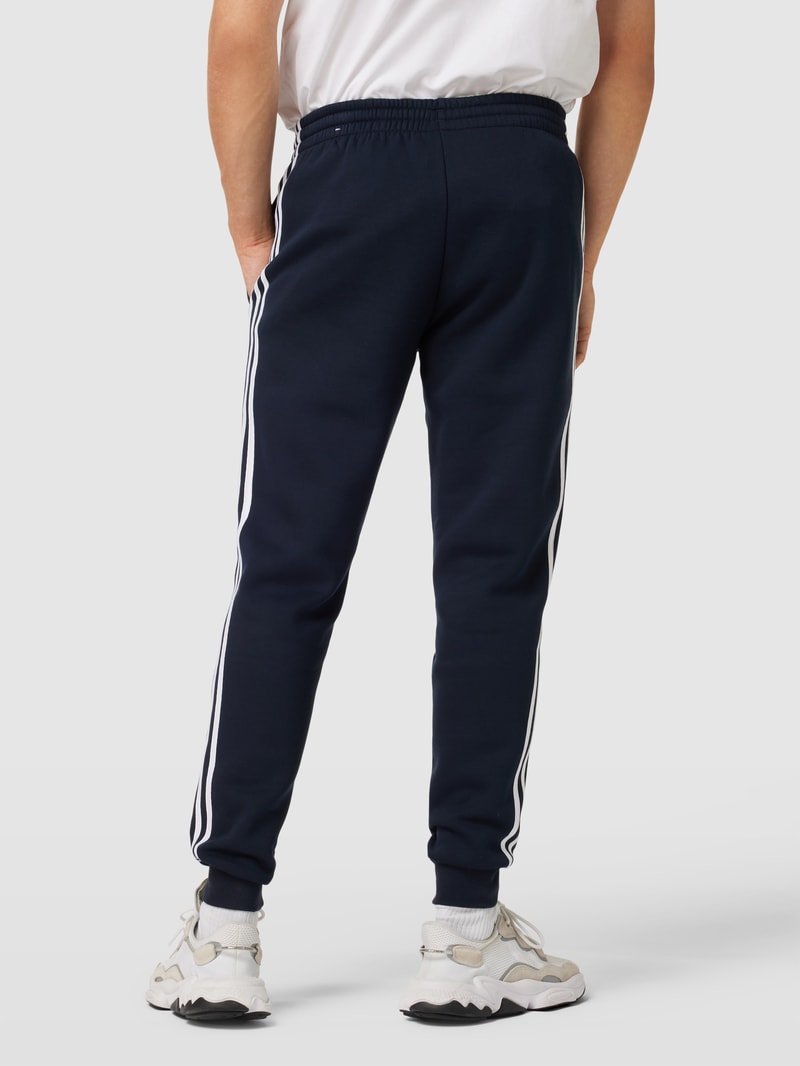 Sweatpants mit labeltypischen Galonstreifen in marineblau