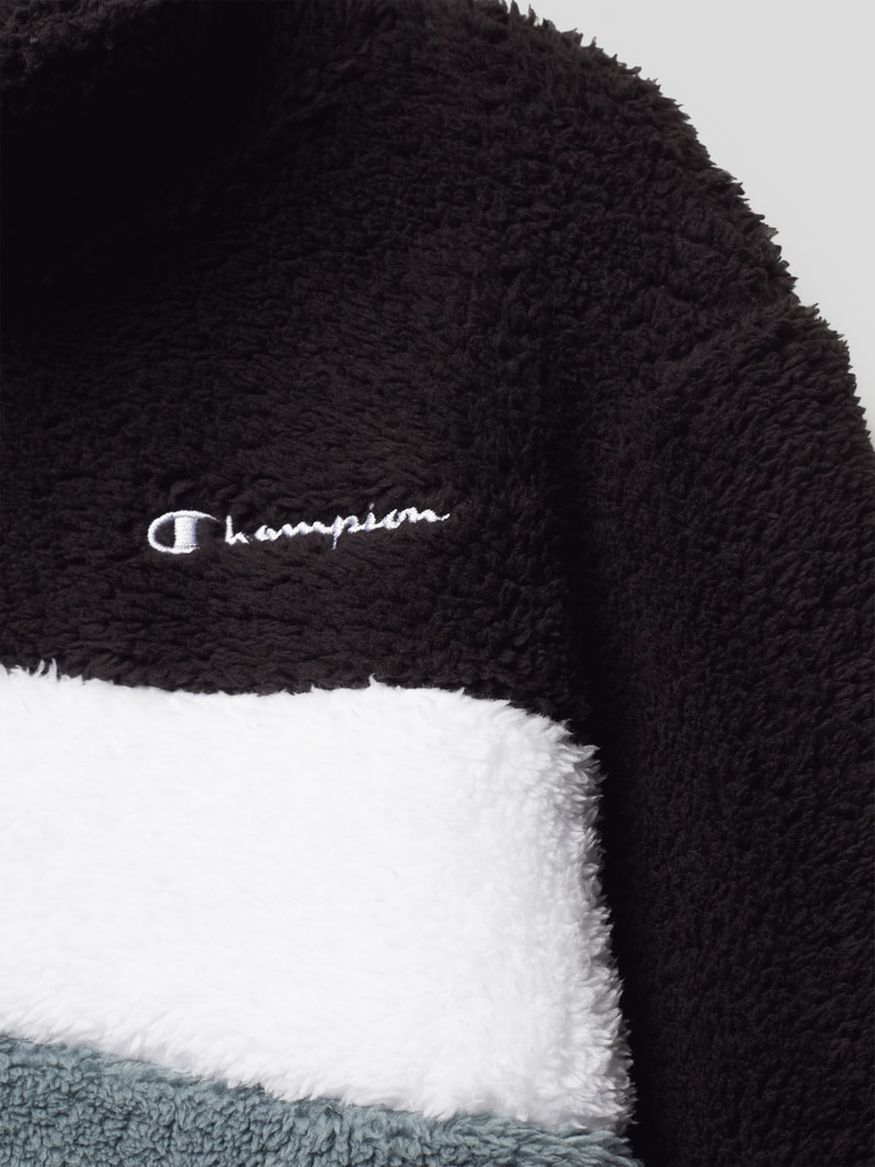 Sweatshirt in Teddyfell-Optik in schwarz