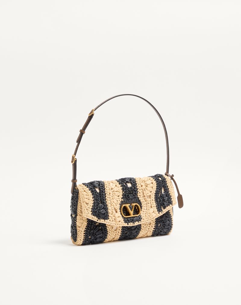 Bolsa de ombro pequena Valentino Garavani Devain em ráfia com motivo de ondas.