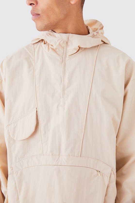 Regenjacke mit halbem Reißverschluss und Kapuze