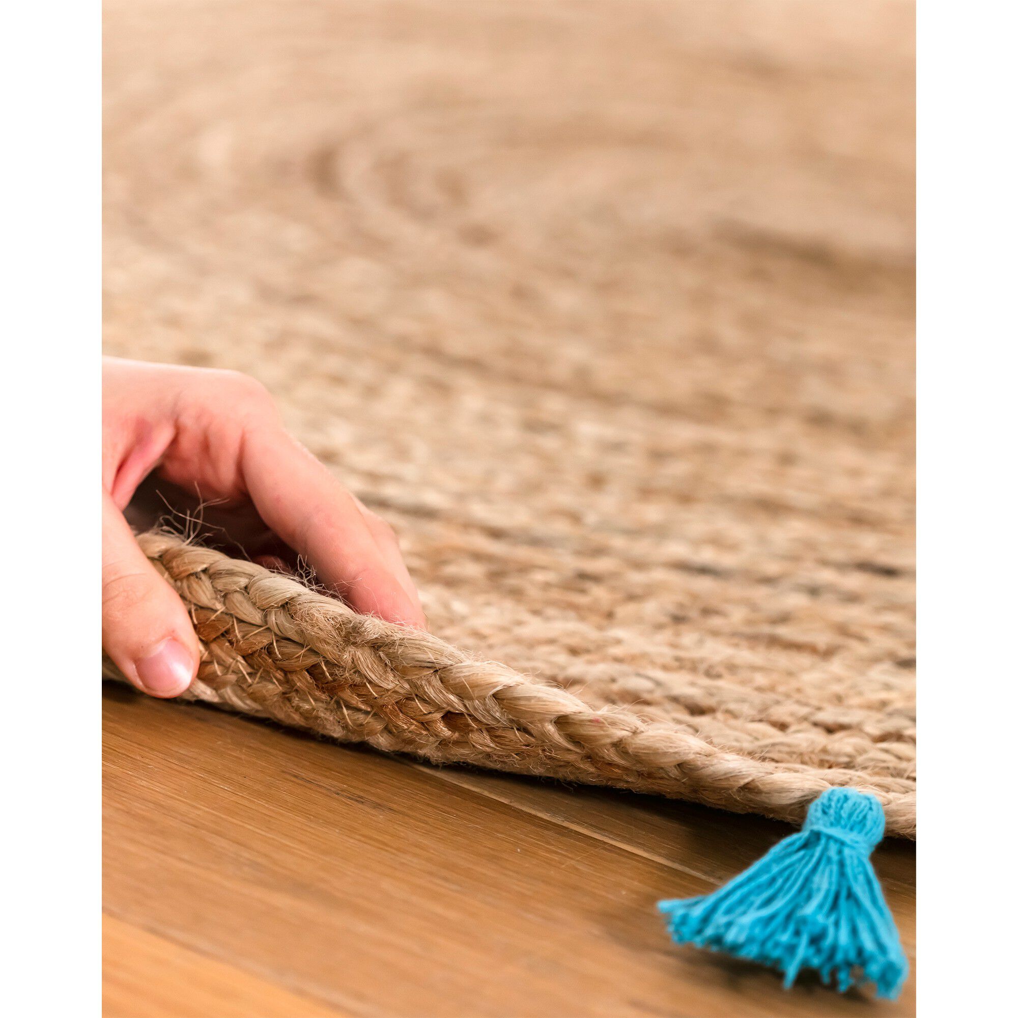 Tapis rond en jute avec pompons de couleur
