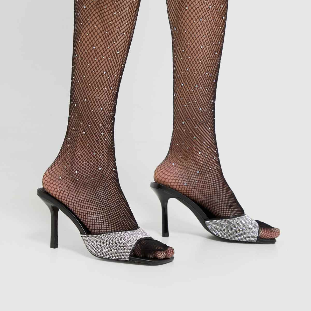 Schuh – Svarta högklackade muleskor med sherryutsmyckning