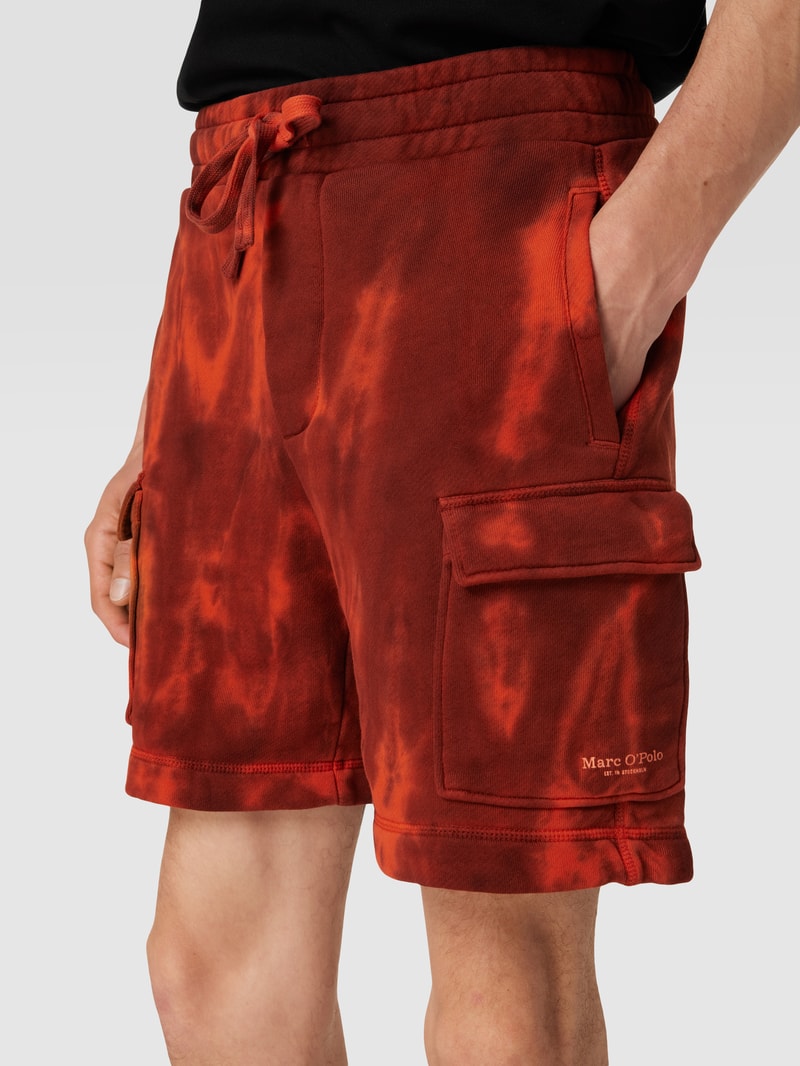 Sweatshorts mit Batik-Look in dunkel orange