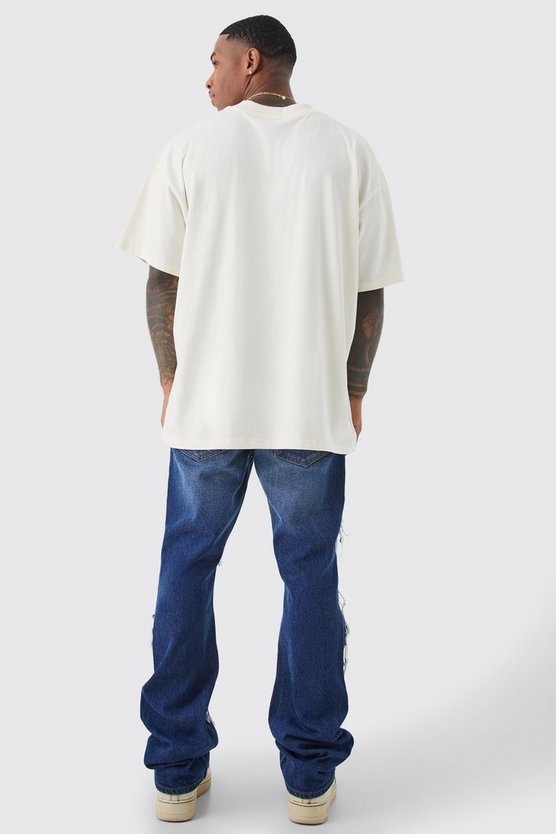 Slim-Fit Schlagjeans mit Kontrast-Riss