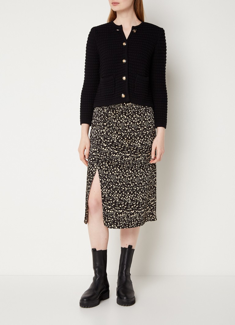Cardigan Gaspard tricotat gros, croială scurtă și umeri cu burete, disponibil la ba&sh.