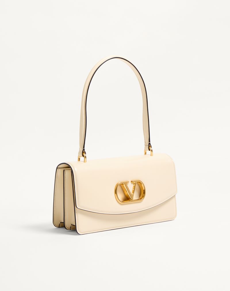 Bolsa Valentino Garavani Vain em couro de bezerro brilhante com alça.