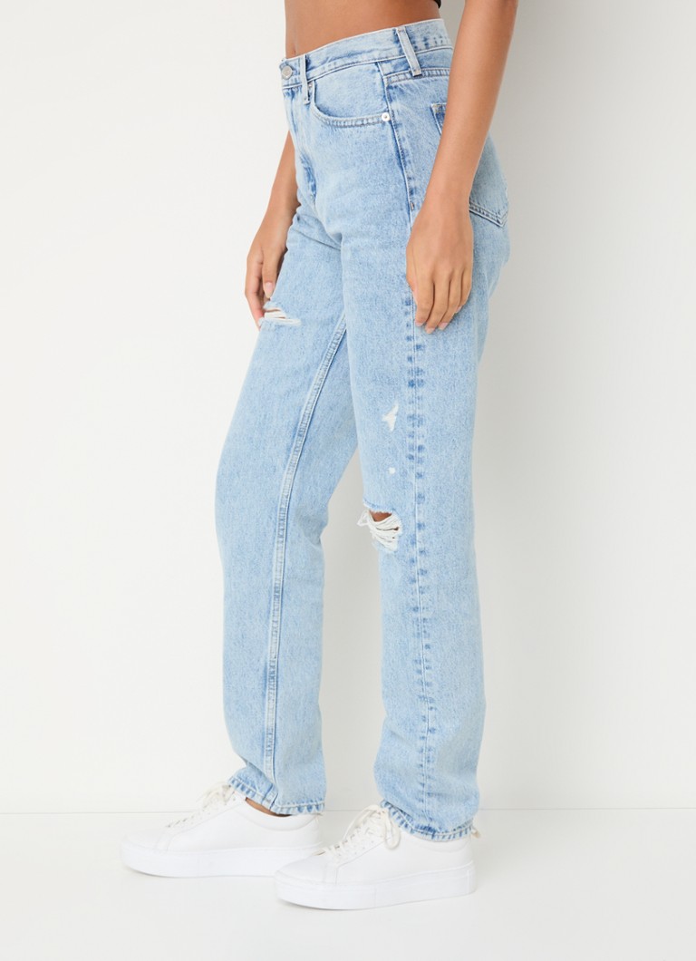 Calvin Klein high-waist slim-fit jeans with a light wash and destroyed finish