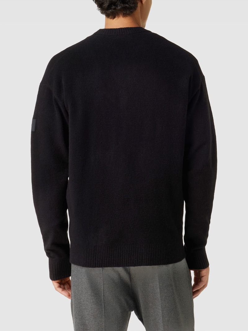Strickpullover mit Label-Patch Modell 'LYCRA' in schwarz