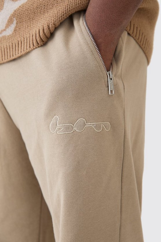 Plus gerippte Oversize Jogginghose mit Applikation und Reißverschluss
