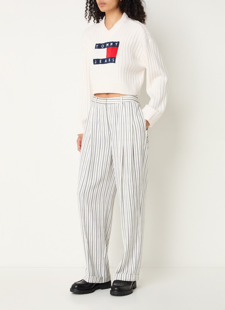 Ψηλόμεσο φαρδύ παντελόνι Tommy Hilfiger με γραφικό τύπωμα και πλαϊνές τσέπες.