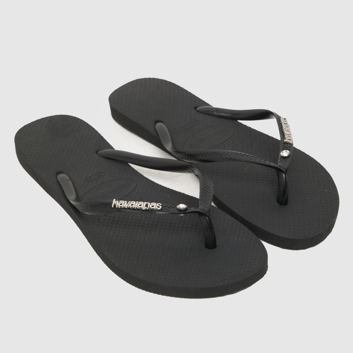 Havaianas – Svarta smala sandaler med metalllogotyp och kristaller