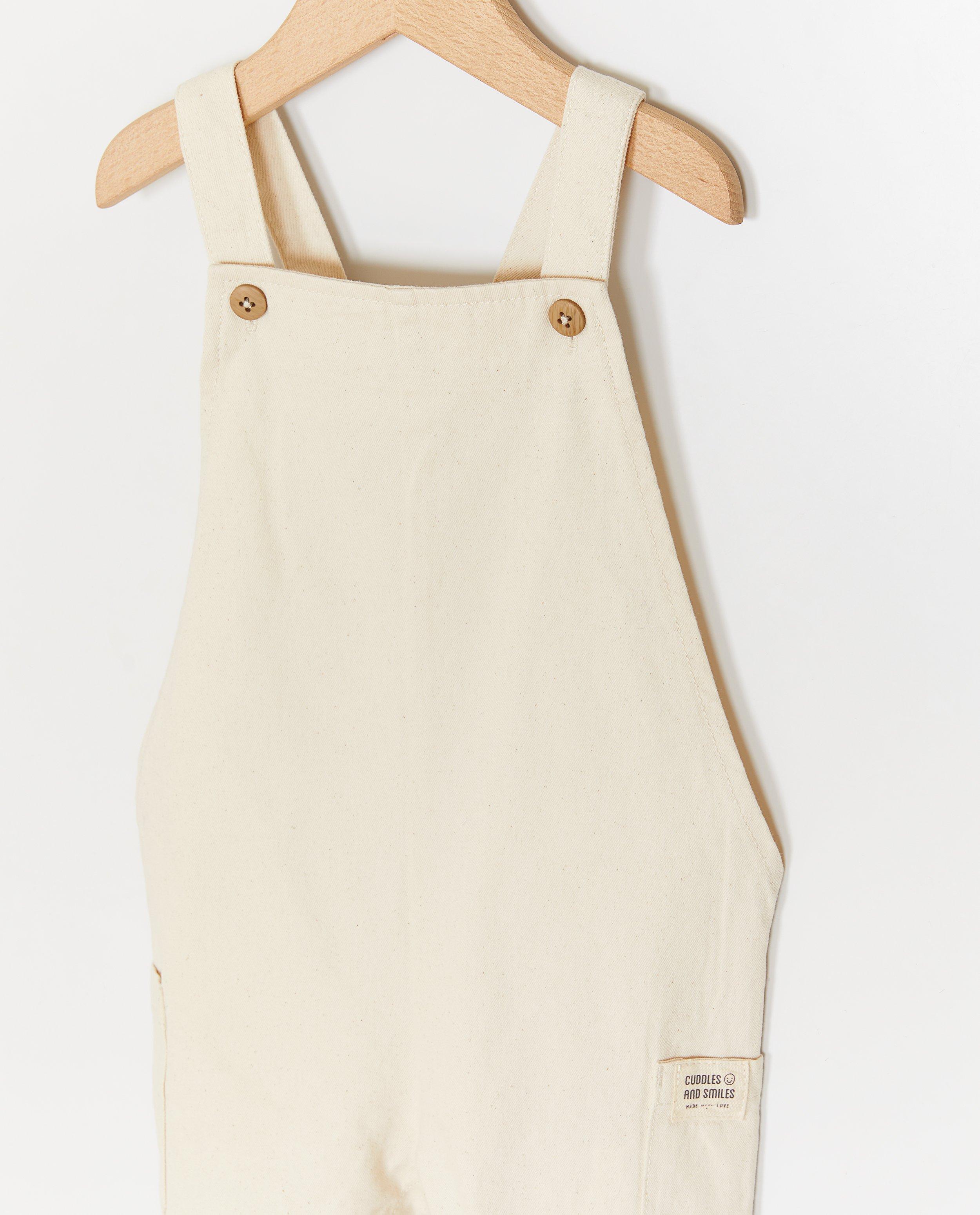 Cuddles and Smiles Beige salopette vit