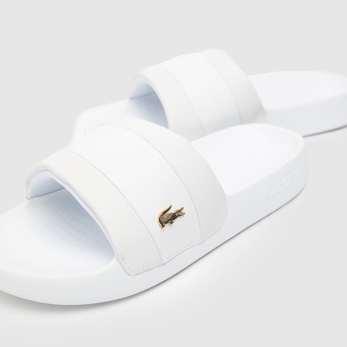 Lacoste – Serve – Vita hybridsandaler med tofs
