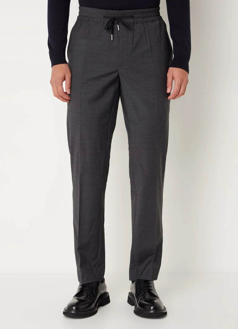 Pantaloni chino Sandro din amestec de lână, cu croială mulată și buzunare laterale.