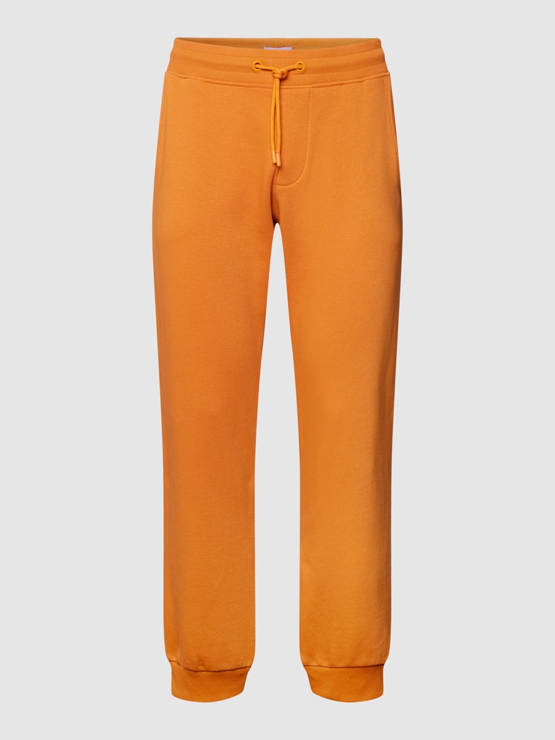 Sweatpants mit Eingrifftaschen in dunkel orange
