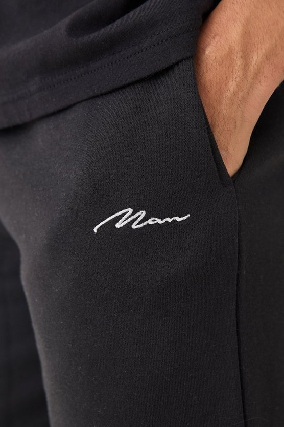 Man Signature Loose Fit Mid Length Shorts