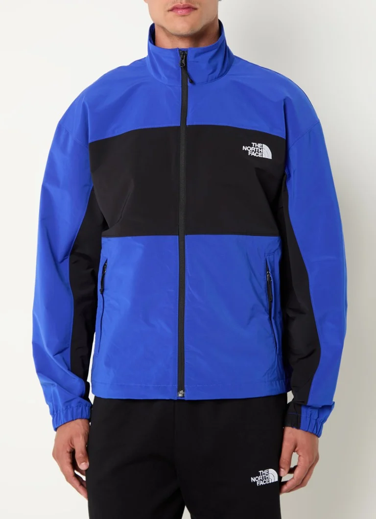 Vjetrovka The North Face s logotipom i džepovima s patentnim zatvaračem