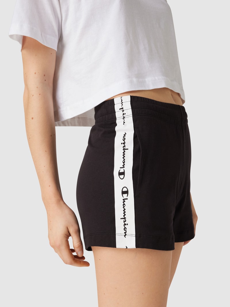Sweatshorts mit Galonstreifen in schwarz