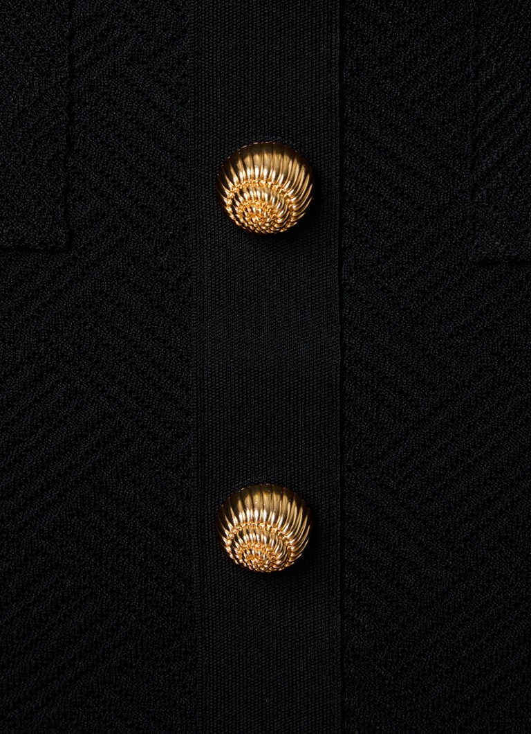 Gonna corta a tubino Balmain in maglia grossa con bottoni decorativi.