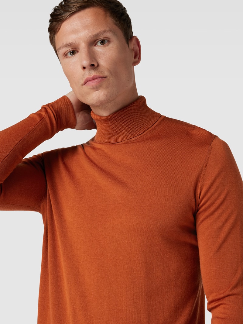 Rollkragenpullover aus Schurwolle mit gerippten Abschlüssen in orange