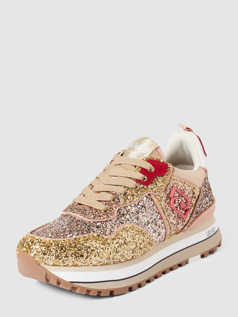 Sneaker mit Zierbesatz in gold