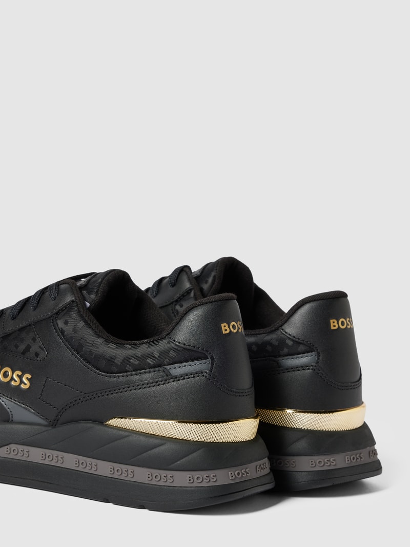 Sneaker aus Leder-Mix in schwarz