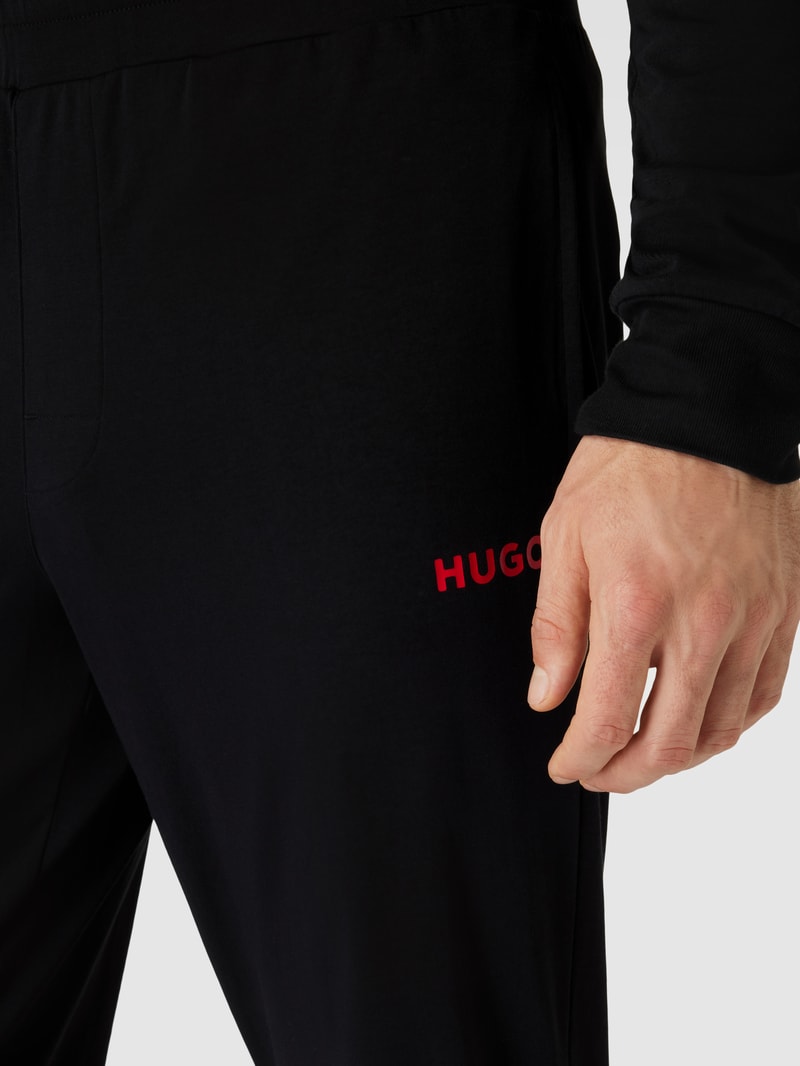 Sweatpants in unifarbenem Design mit elastischem Bund in schwarz