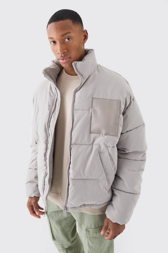 Kastige Oversize Nylon-Steppjacke mit PU-Aufnäher