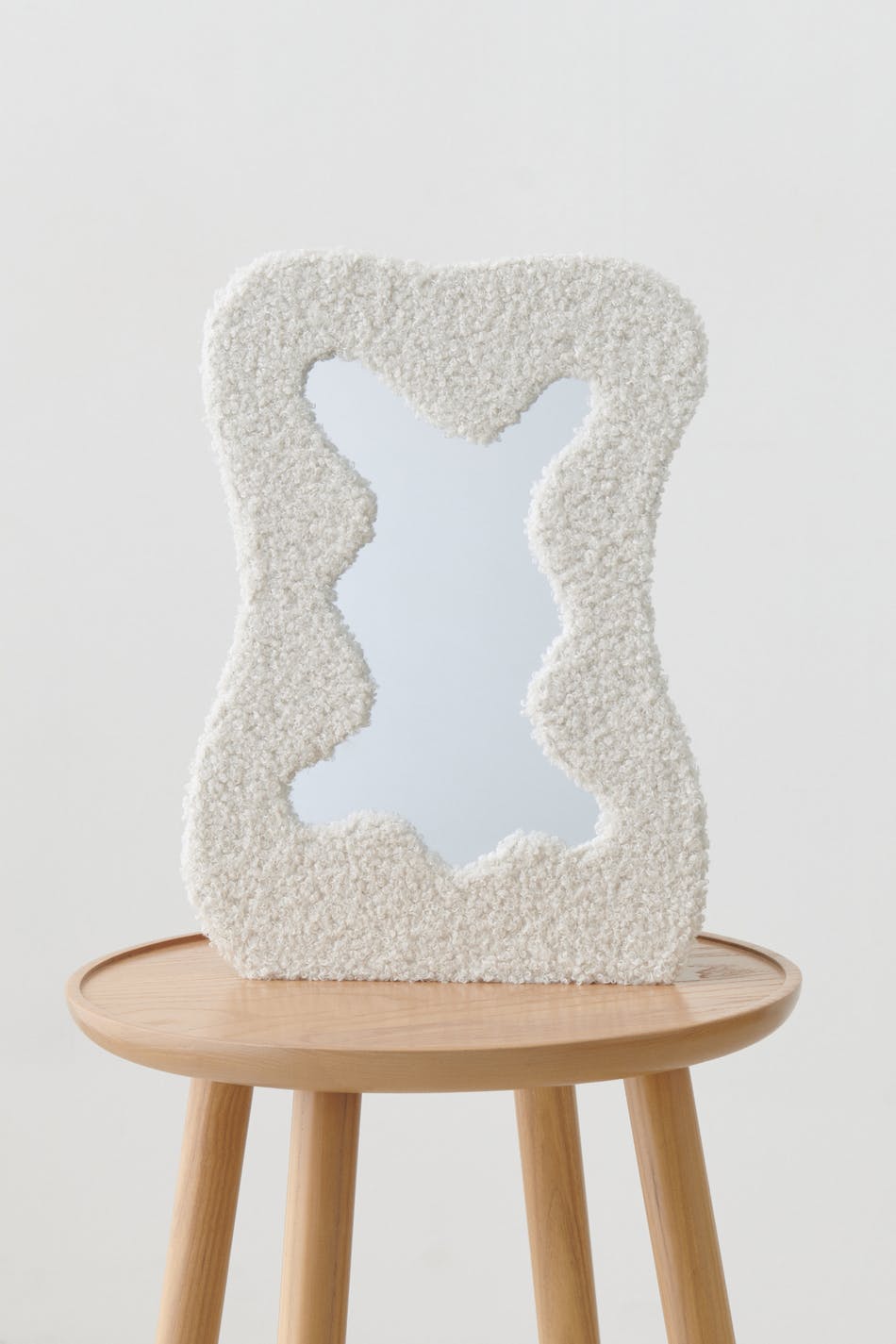 Tufted mirror