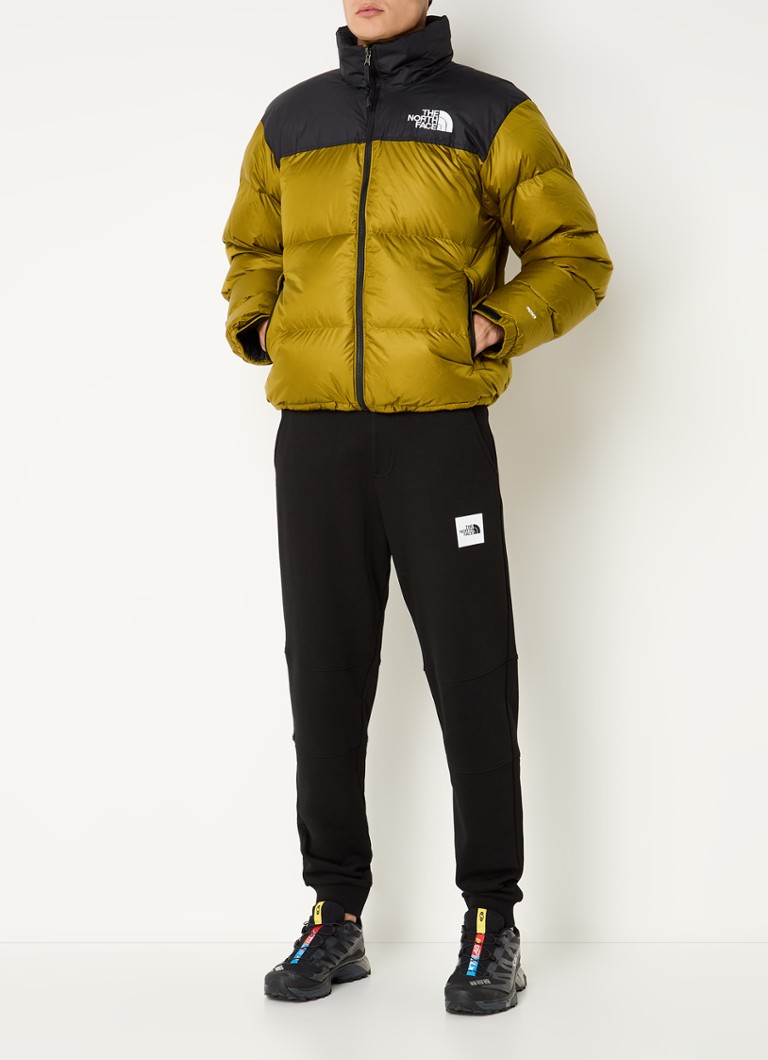 Jaqueta puffer retrô Nuptse da The North Face, modelo 1996, com enchimento de plumas e logotipo.